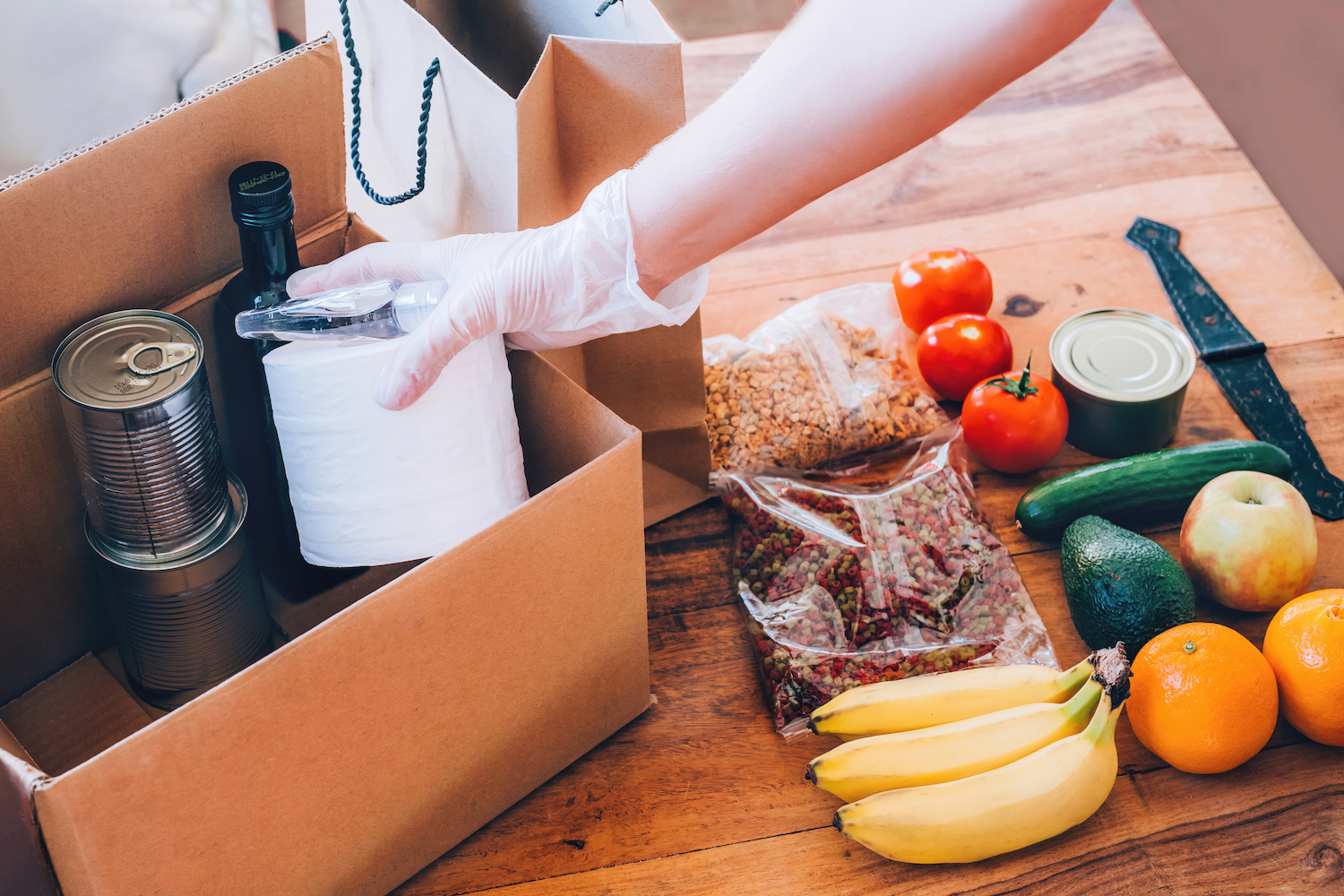 Packaging a box at a food bank.