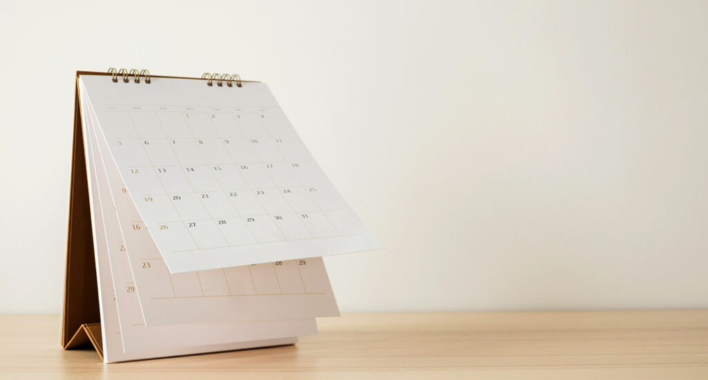 Desk calendar with flipped page.