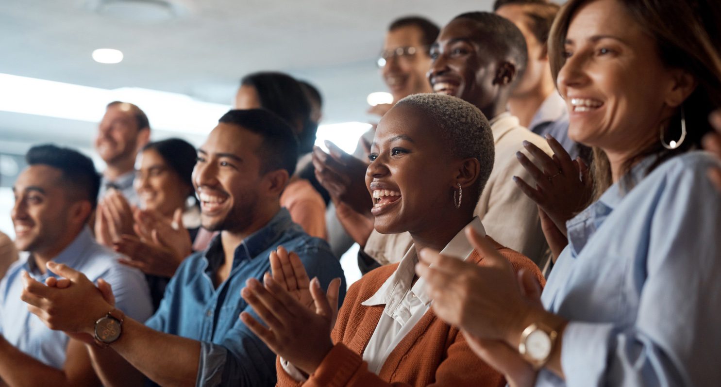 Group of colleagues applauding.
