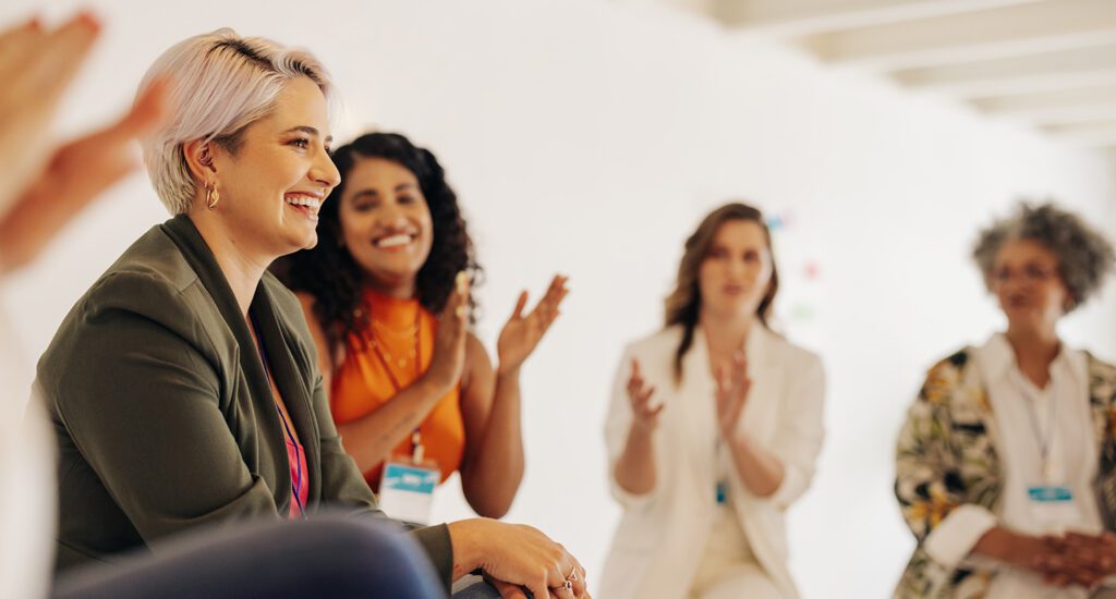 Women Appluading Colleagues